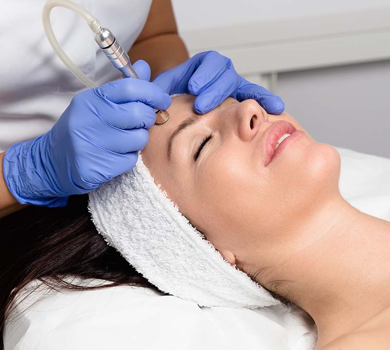 Beautiful woman getting facial microdermabrasion