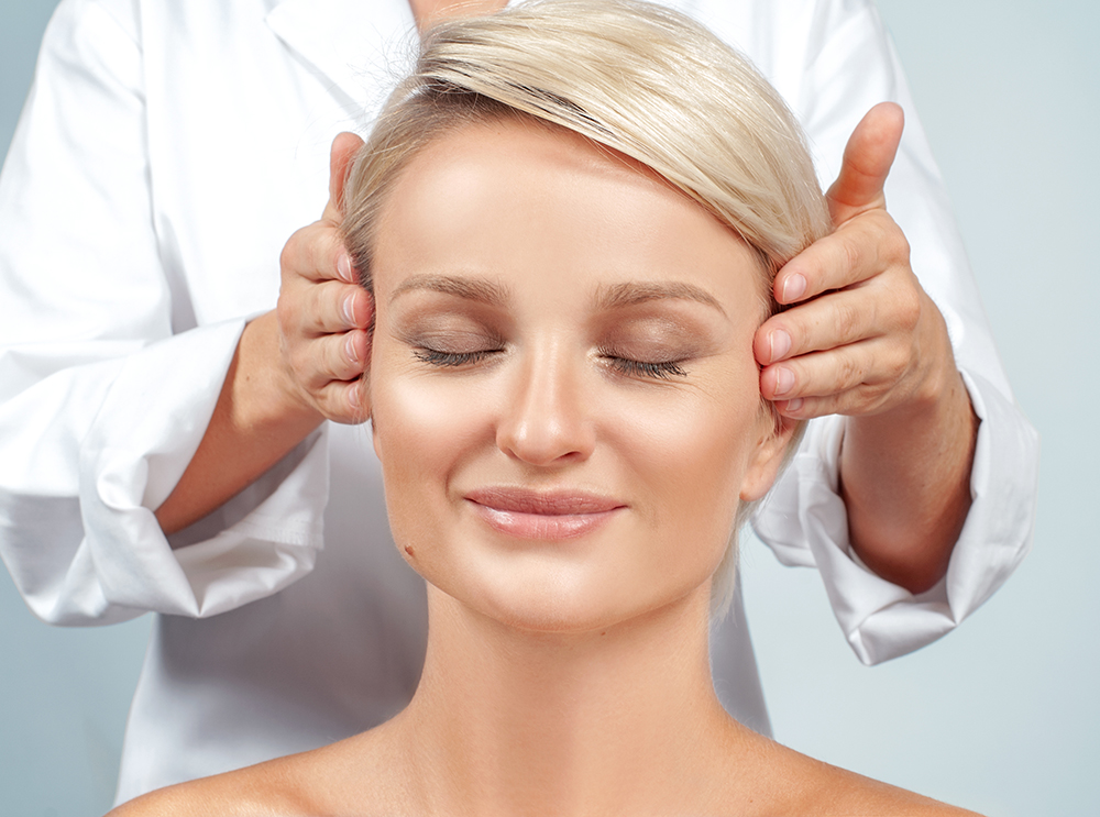 Beautiful woman at a facial massage.