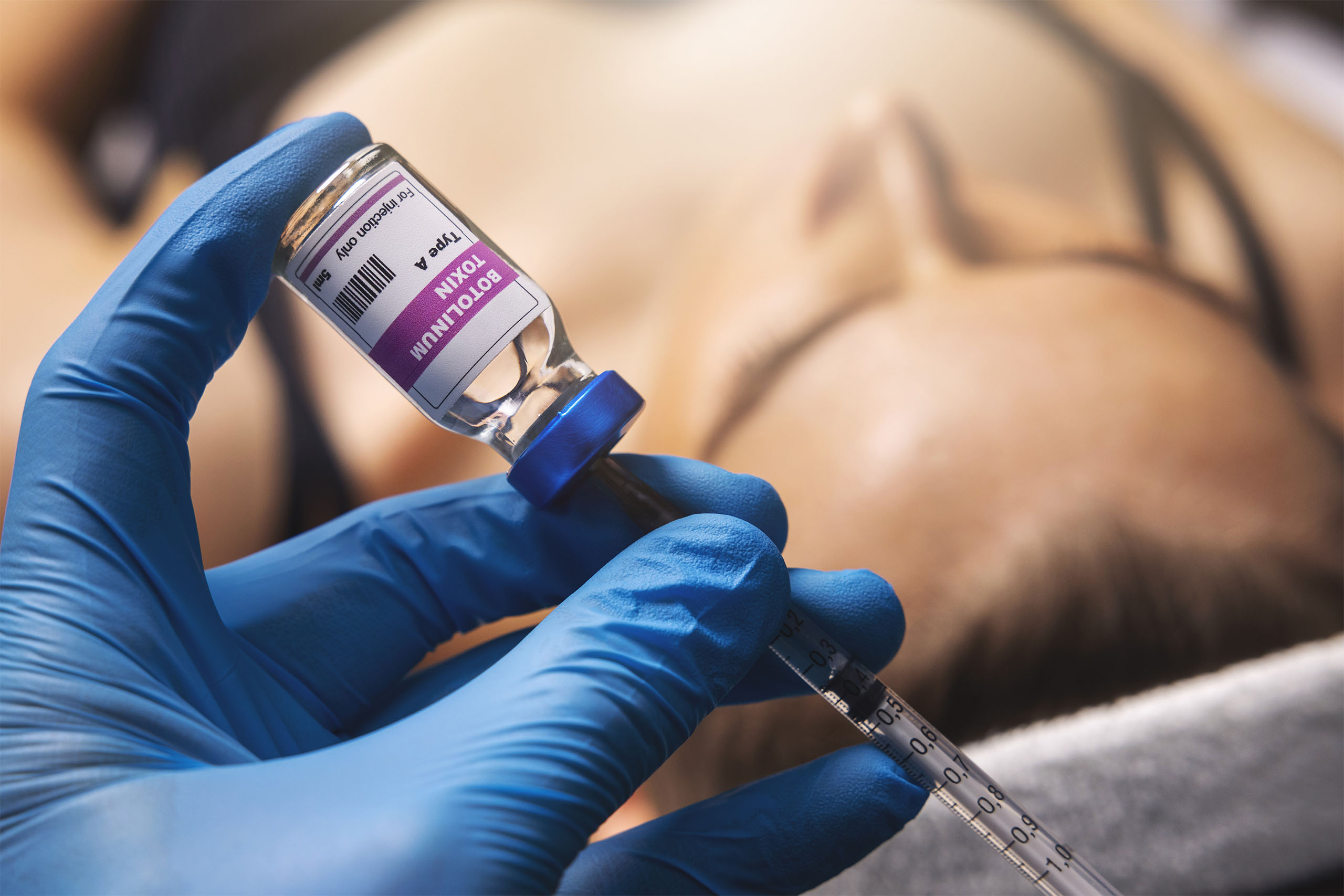 Cosmetic botox injection, filling syringe with botulinum toxin